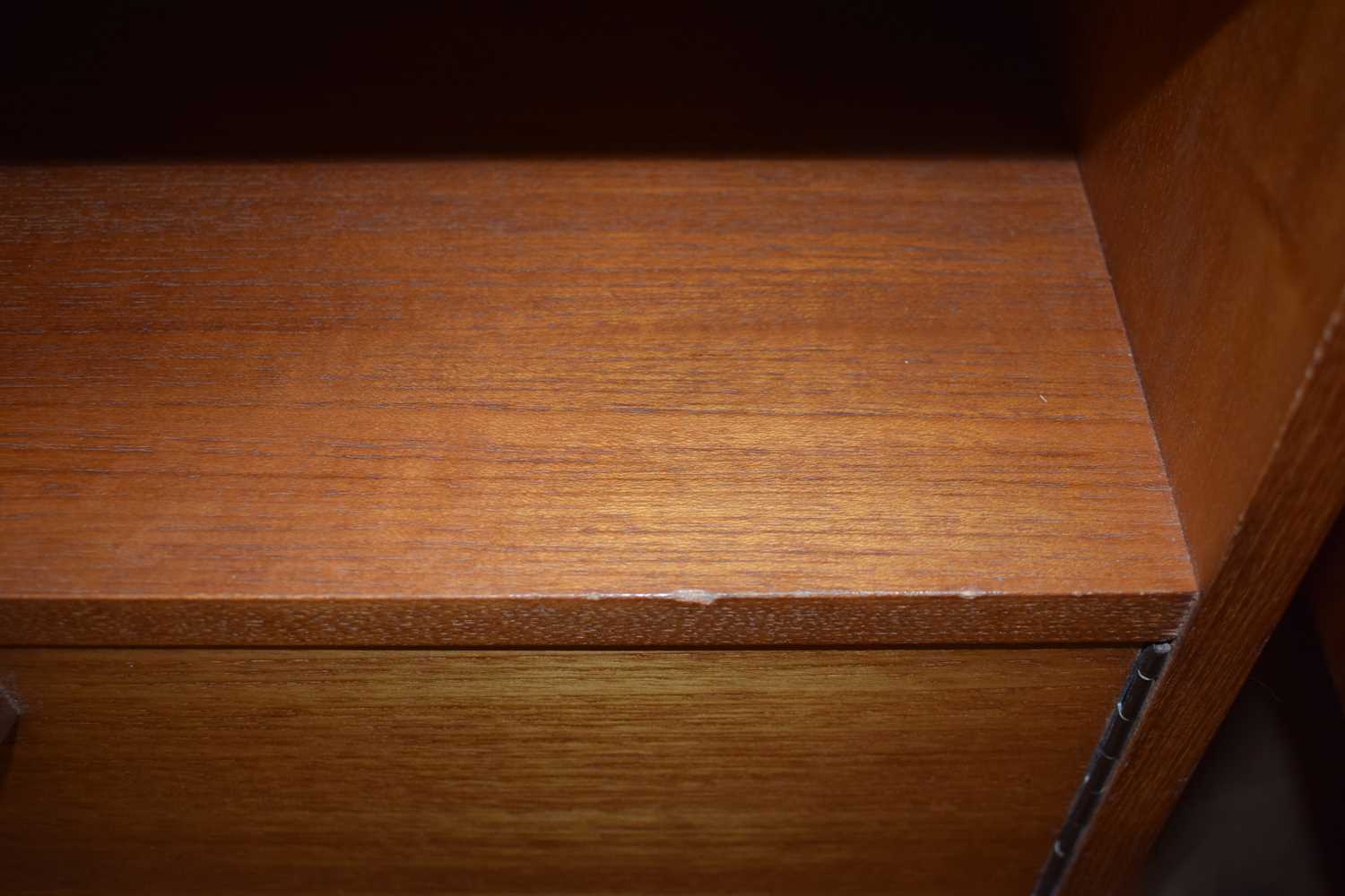 A pair of 1970's teak bedside cabinet, each with a single door, moulded handle and later tapering - Image 3 of 3