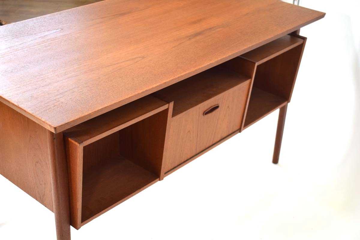 A 1960's Danish teak and crossbanded desk, the rectangular surface over 'levitating' pedestals and - Image 4 of 4