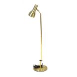 A 1970's Danish half-height brass-finished adjustable standard lamp Lead cut, working order unknown,