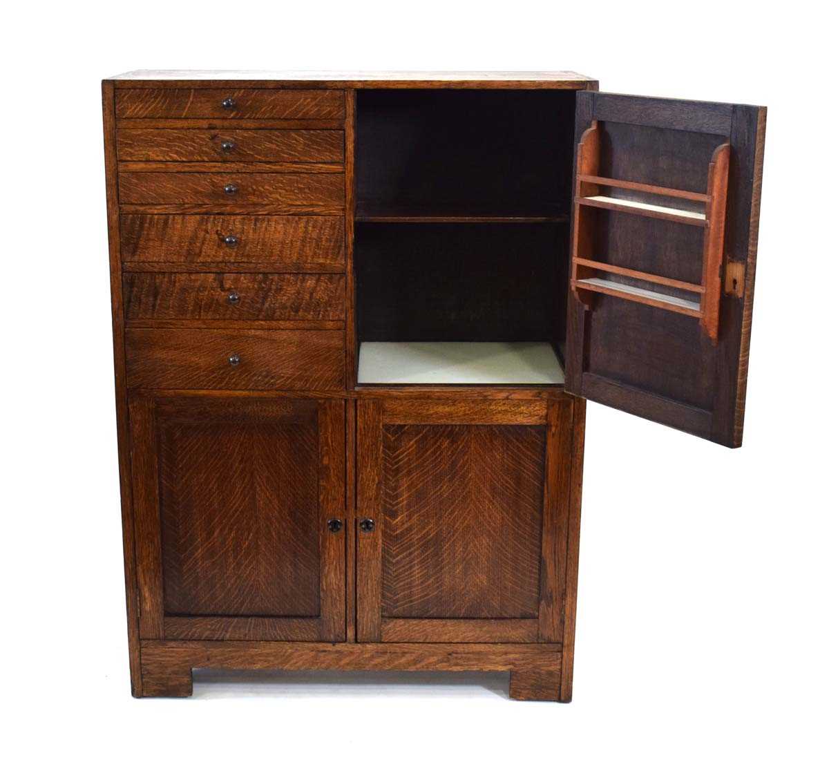 A 1930's oak dentist's cabinet with an arrangement of doors and drawers, 77 x 32 x 106 cm *A similar - Image 2 of 3