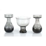 Frank Thrower for Wedgwood, a pair of lead crystal smoke grey vases together with a similar vase (