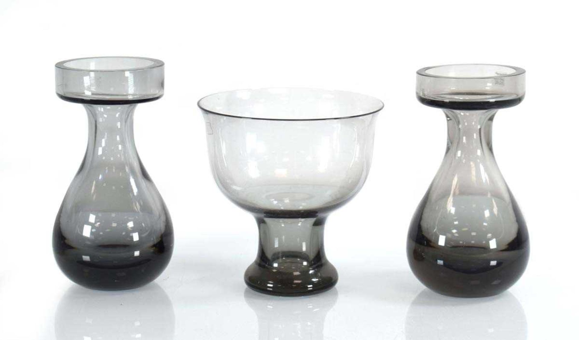 Frank Thrower for Wedgwood, a pair of lead crystal smoke grey vases together with a similar vase (