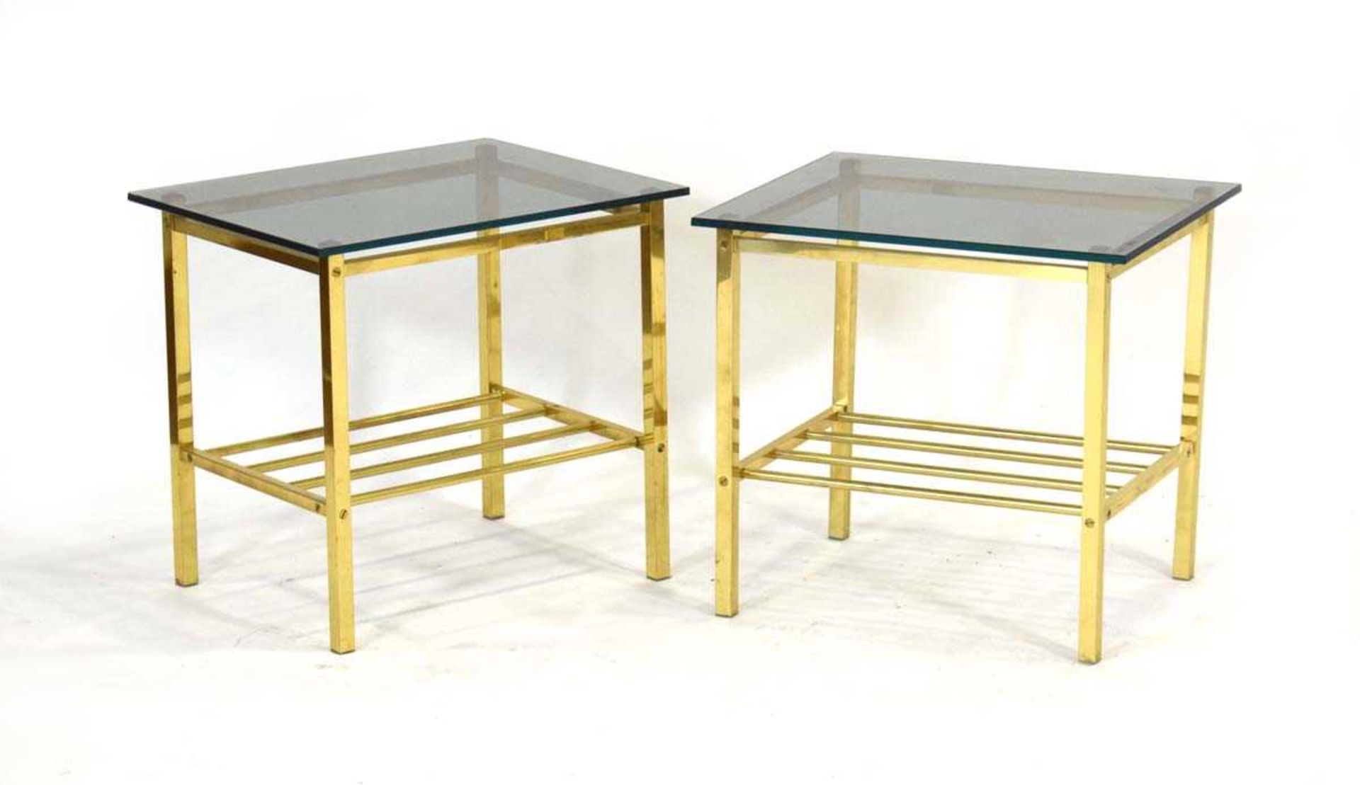 A pair of 1970's brass side tables with later smoked glass surfaces, 50 x 40 x 47 cm (2)