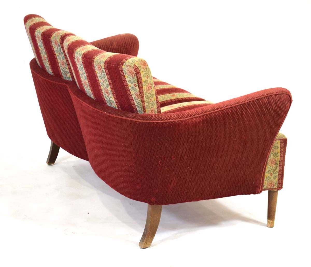 A 1960's Danish two-seater sofa or loveseat with a 'wrap-around' frame, on beech tapering legs *Sold