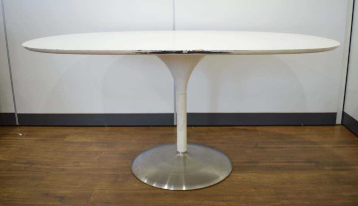 In the manner of Eero Saarinen/Arkana, a 1970's white laminate table of oval form resting on a - Image 2 of 3