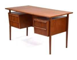 A 1960's Danish teak and crossbanded desk, the rectangular surface over 'levitating' pedestals and