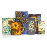 A group of six 1960's ceramic wall plaques depicting sunflowers, by Ruscha and others (6)