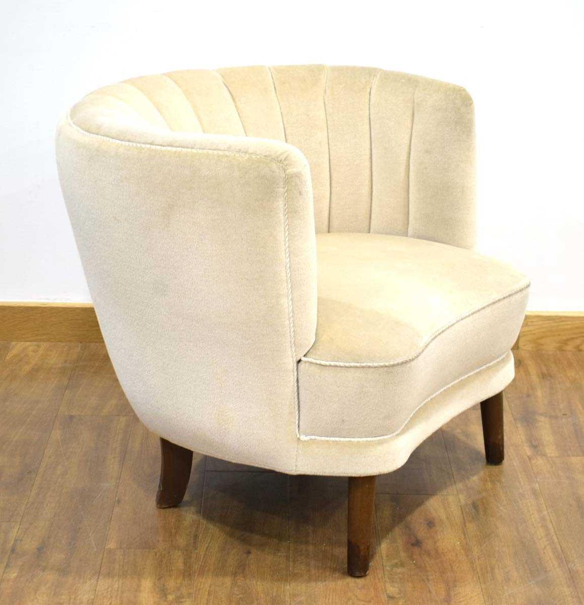 A 1950's Danish 'Shell' armchair upholstered in grey on tapering legs *Sold subject to our Soft