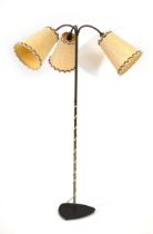 A 1960's Danish three-way brass adjustable standard floor lamp on a cast iron base Lead cut, working