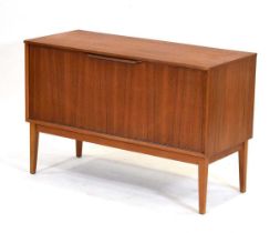 A 1960's Dynatron Limited teak record cabinet with a fall-front, on matched tapering legs, 99 x 42 x