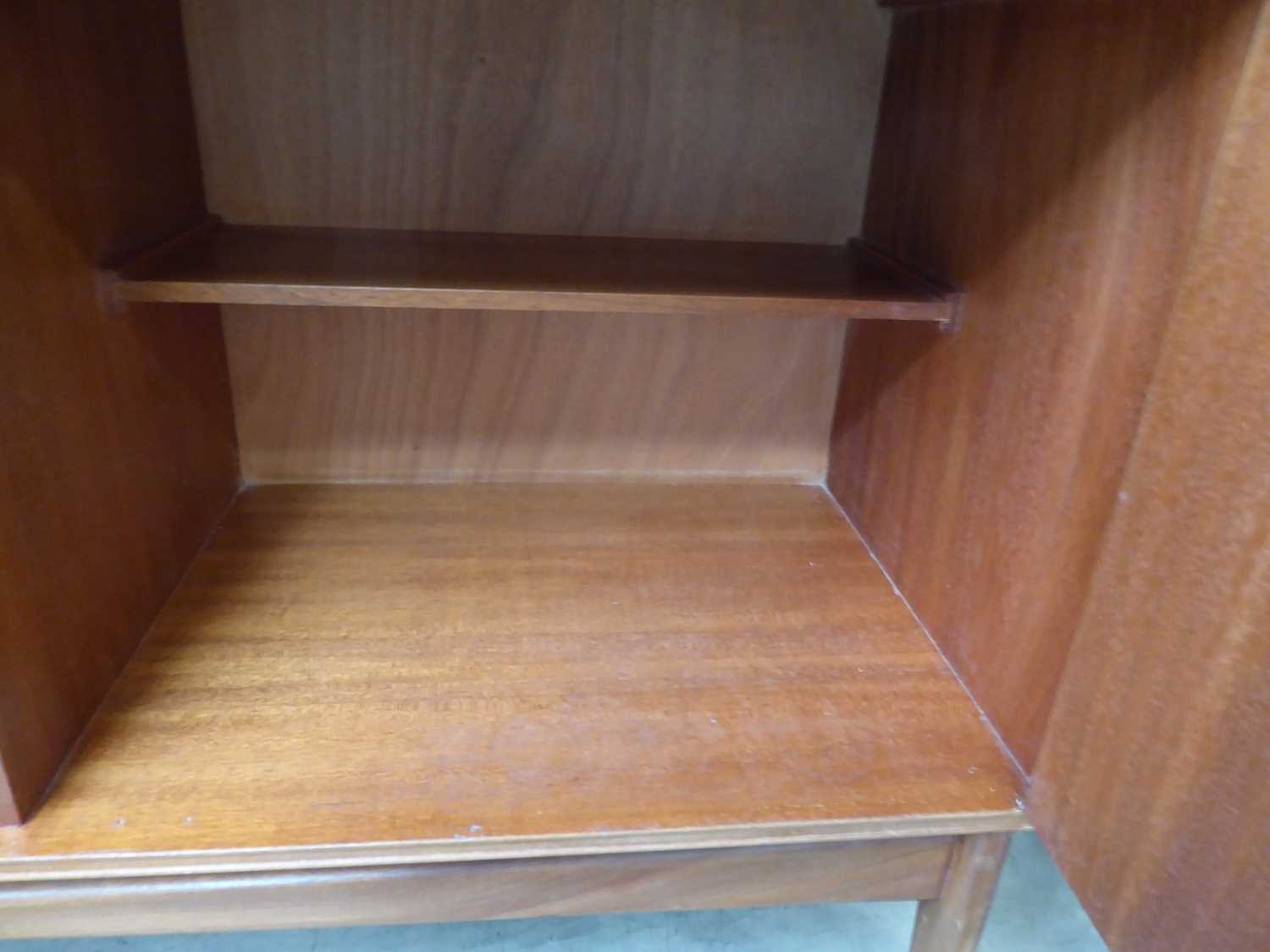 A 1960/70's McIntosh Furniture teak sideboard, the two doors with moulded handles, on triangular - Image 3 of 6