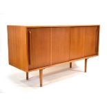 A 1950s Hilleplan sideboard designed by Robin Day, the two sliding doors enclosing shelves and
