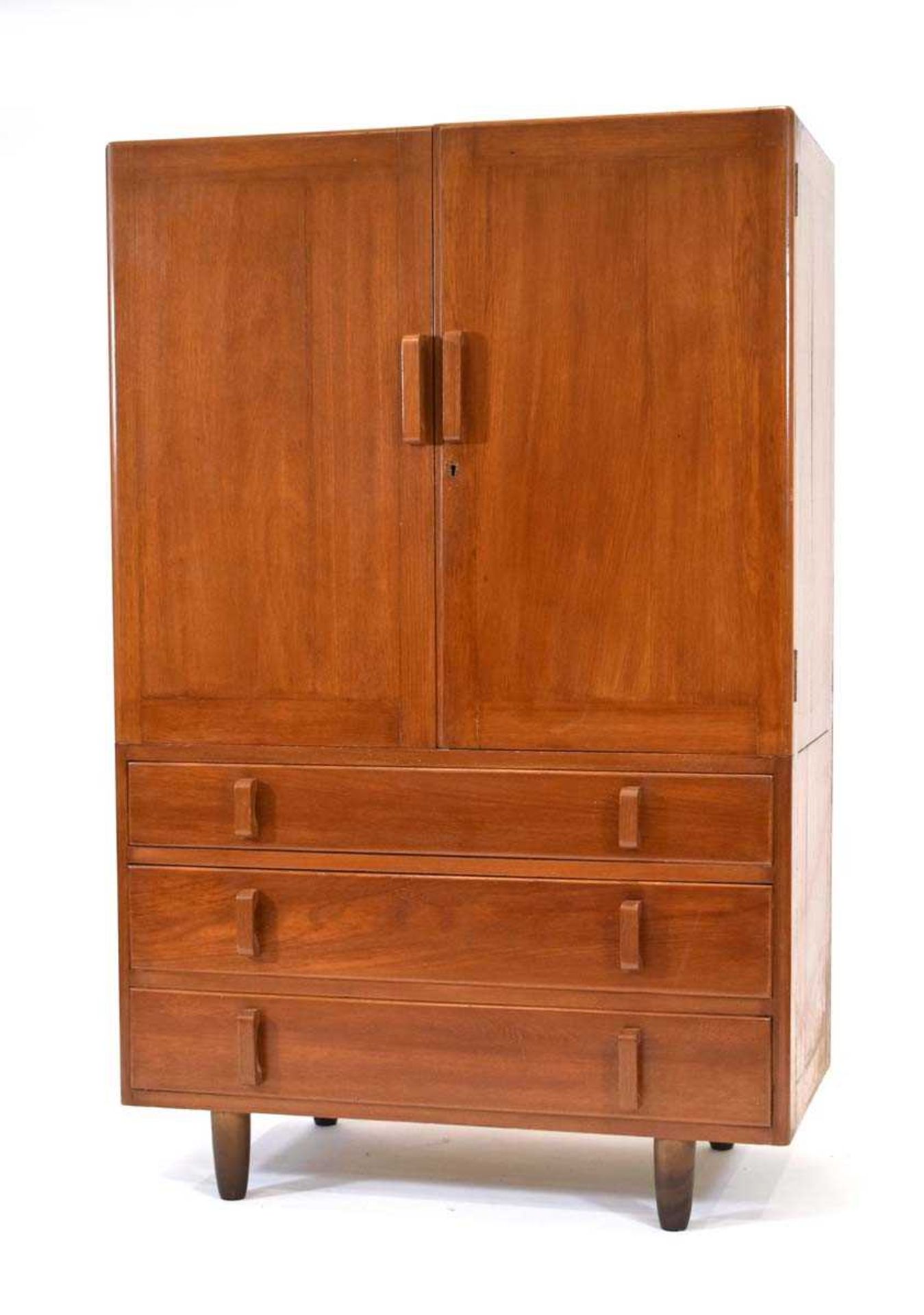 A 1950/60's solid teak dressing cabinet with two doors, two drawers and chunky handles, on later