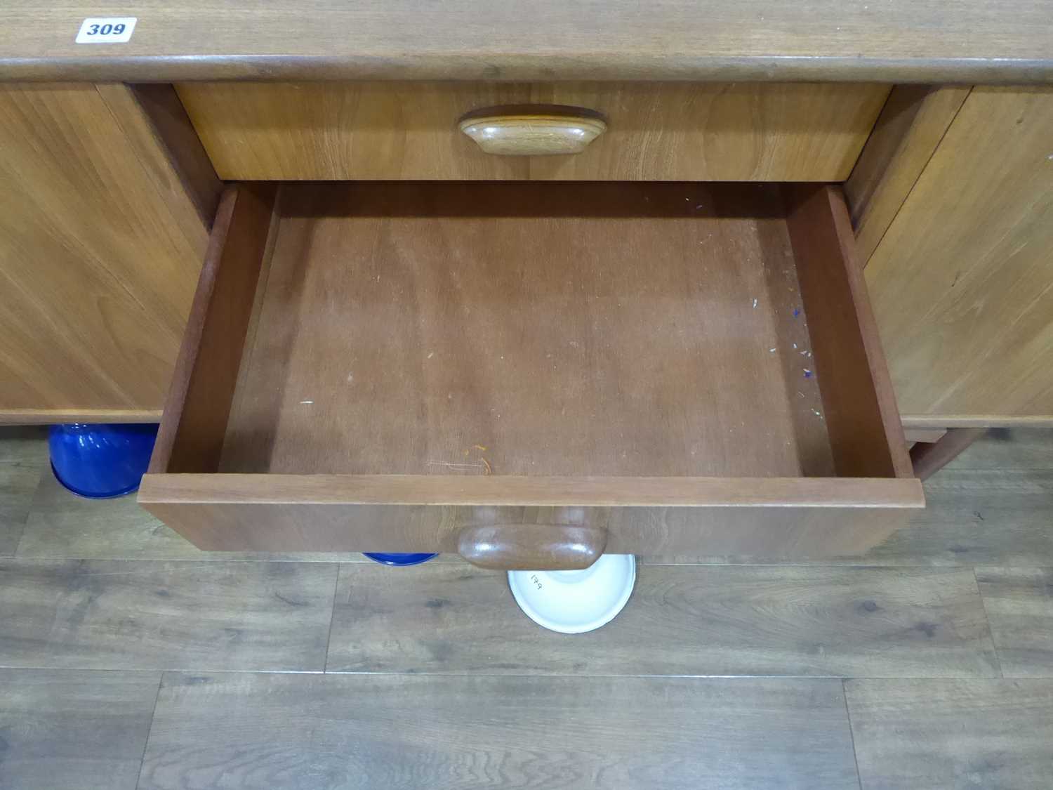 A 1960's G-Plan teak sideboard with a pair of doors, four drawers and a fall-front door, on tapering - Image 22 of 25