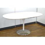 In the manner of Eero Saarinen/Arkana, a 1970's white laminate table of oval form resting on a