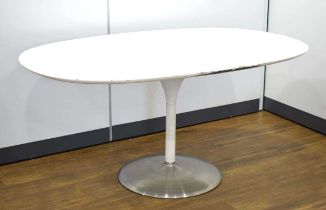 In the manner of Eero Saarinen/Arkana, a 1970's white laminate table of oval form resting on a