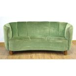 A 1940/50's Danish 'Banana' sofa upholstered in green on mahogany block feet *Sold subject to our