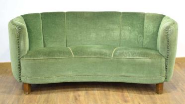 A 1940/50's Danish 'Banana' sofa upholstered in green on mahogany block feet *Sold subject to our