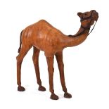 In the manner of Liberty of London, a leather-clad figure modelled as a camel, h. 91 cm