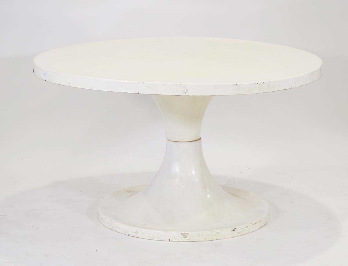 A 1960/70's fibreglass table, the white surface resting on an hour-glass shape base, di. 120 cm