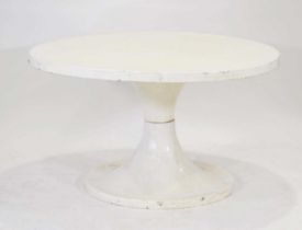 A 1960/70's fibreglass table, the white surface resting on an hour-glass shape base, di. 120 cm
