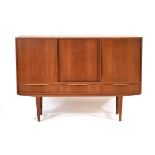 E W Bach for Sejling Skabe, a 1960's Danish teak sideboard with three sliding doors enclosing