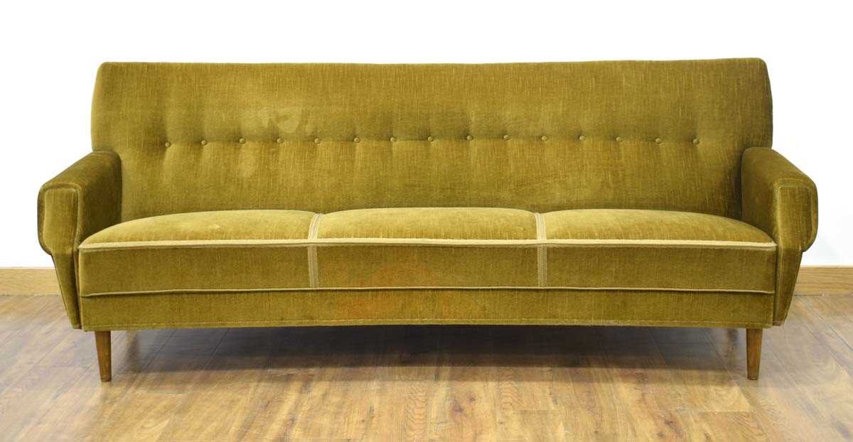 A 1960's Danish bow-fronted green button-upholstered sofa on mahogany tapering legs, w. 200 cm