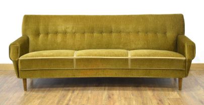 A 1960's Danish bow-fronted green button-upholstered sofa on mahogany tapering legs, w. 200 cm