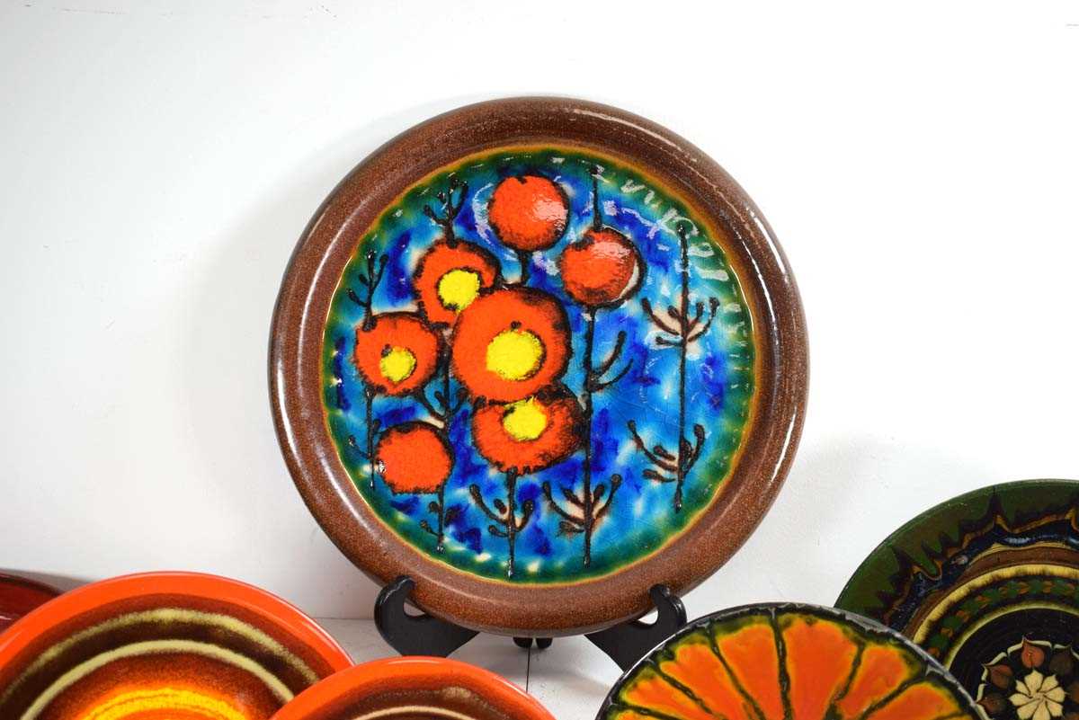 A group of 1960's German, Hungarian and other chargers and bowls decorated in bright glazes, - Image 3 of 3