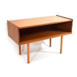 A 1970's teak open side/console table on later cylindrical legs, w. 102 cm