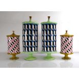 A pair of Jonathan Adler ceramic cylindrical footed cannisters, h. 38 cm, together with a smaller