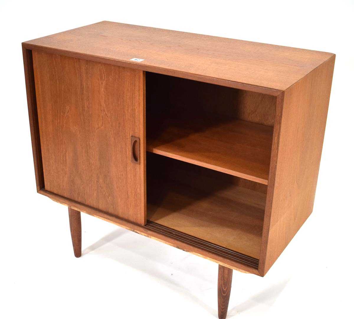 A 1960's Danish teak cabinet with two sliding doors enclosing a single shelf, on later turned - Image 2 of 2