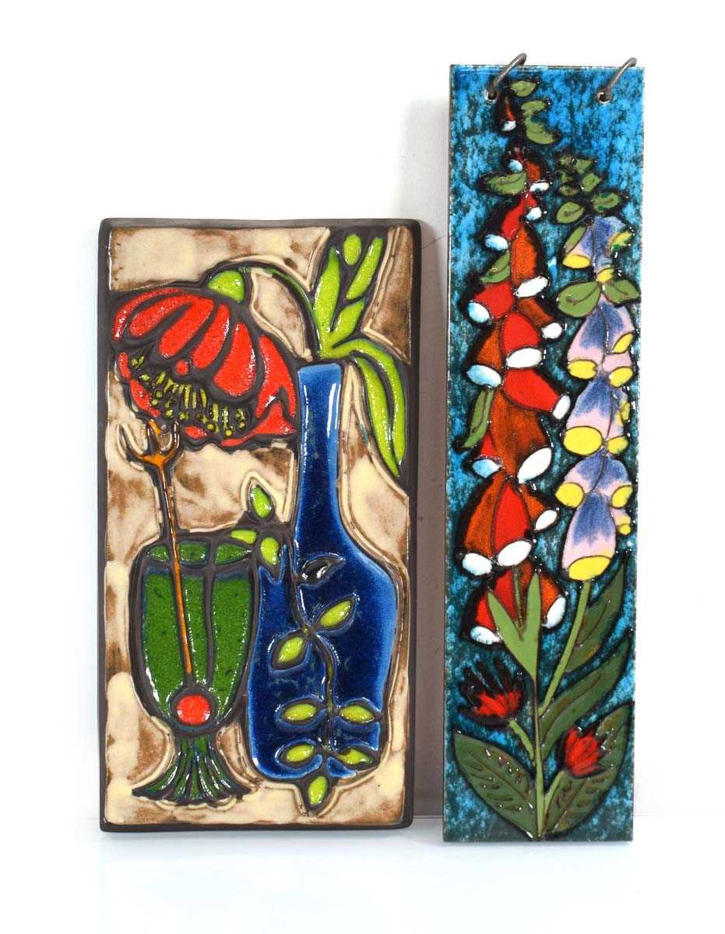 A 1960's German wall plaque decorated with foxgloves, 50 x 12 cm, together with another plaque