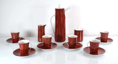 A 1960's Polish fifteen-piece Cmielow coffee set decorated in red and white