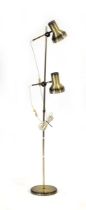 A 1970's Danish 'burnt brass' twin-spot floor lamp Lead cut, working order unknown, some wear.