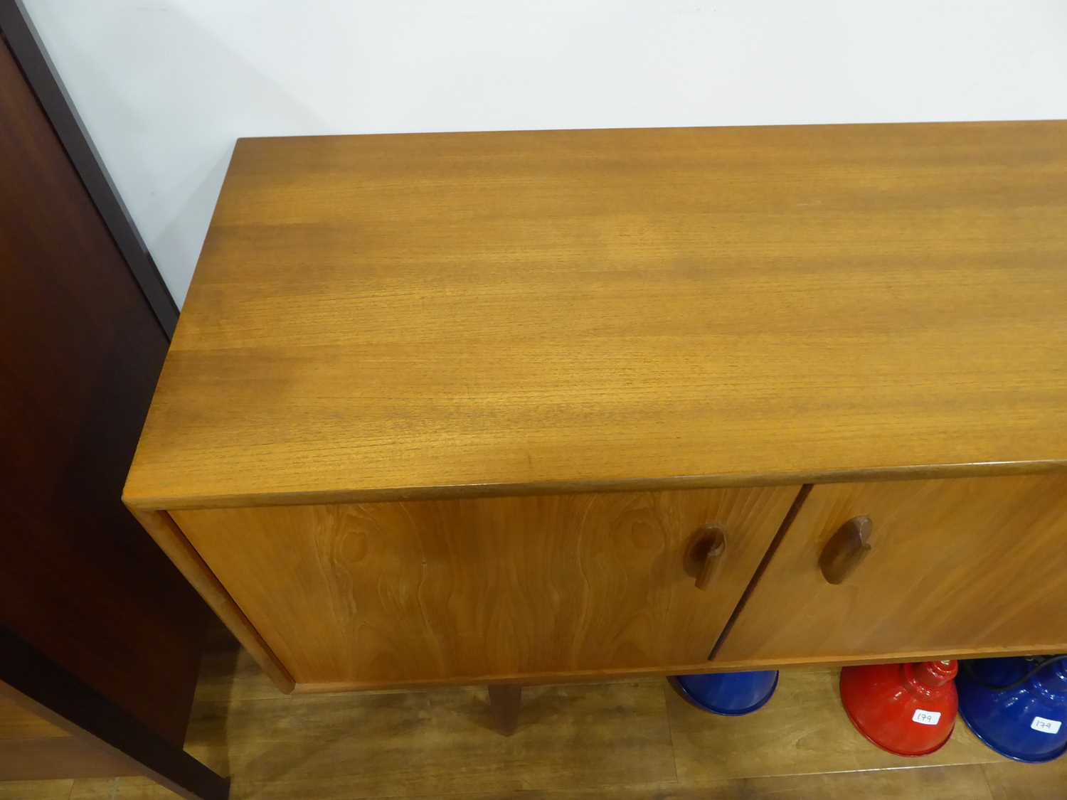 A 1960's G-Plan teak sideboard with a pair of doors, four drawers and a fall-front door, on tapering - Image 12 of 25