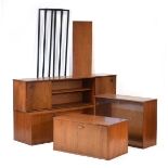 An Avalon teak modular shelving system including three uprights, a three-drawer and two-door