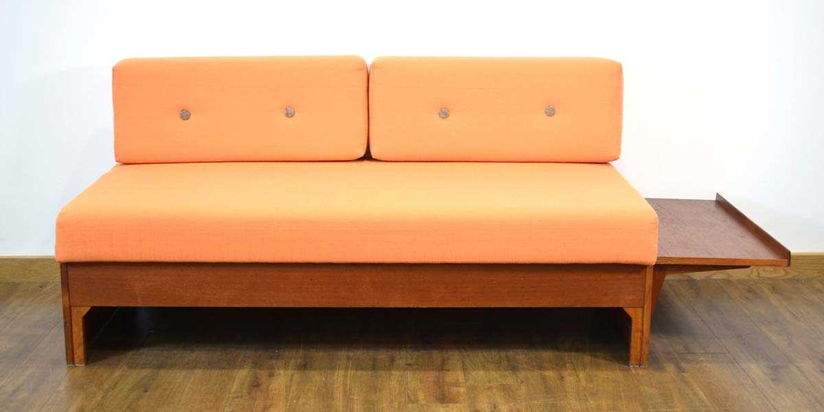 A 1960/70's teak daybed, the orange button-upholstered seat with two loose back cushions, the side - Image 2 of 12