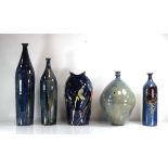 A graduated set of three stoneware bottle vases, max h. 54 cm, together with two further similar