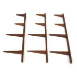 A set of three Scandinavian teak graduated wall-mounted uprights for wall shelves (3) 92 cm tall
