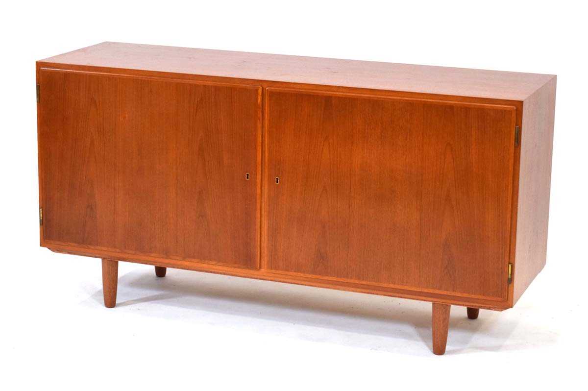 In the manner of Poul Hundevad, a 1960's Danish teak and crossbanded sideboard, the two doors