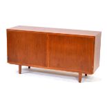 In the manner of Poul Hundevad, a 1960's Danish teak and crossbanded sideboard, the two doors