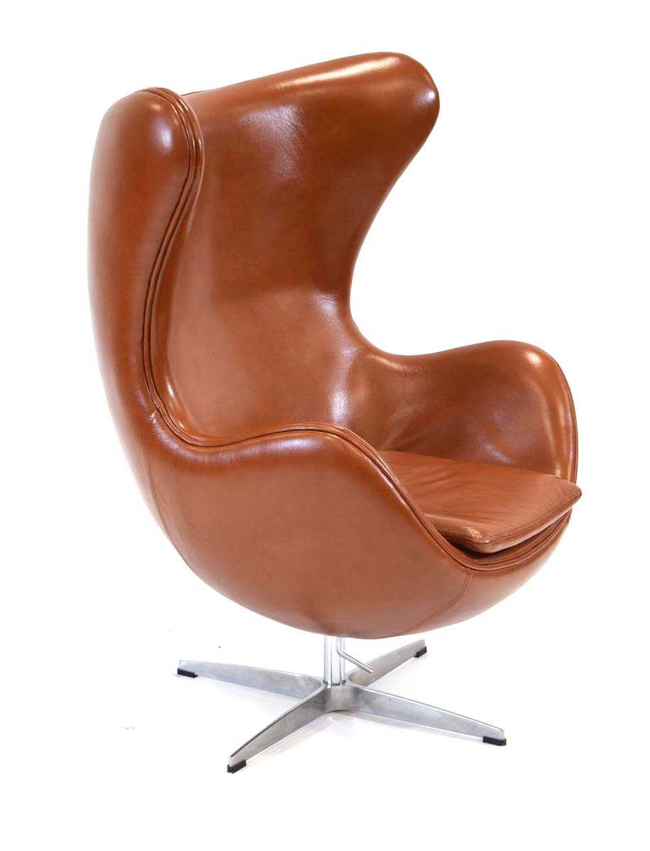 After Arne Jacobsen, an 'Egg' chair upholstered in brown leather on a four-star chromed base *Sold