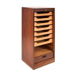 A 1950's Danish teak tambour cabinet fitted with seven beech drawers on a plinth base, 45 x 35 x 108