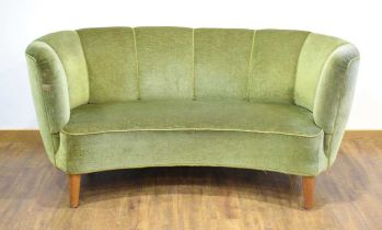 A 1950's Danish 'Banana' sofa upholstered in green on teak triangular feet *Sold subject to our Soft