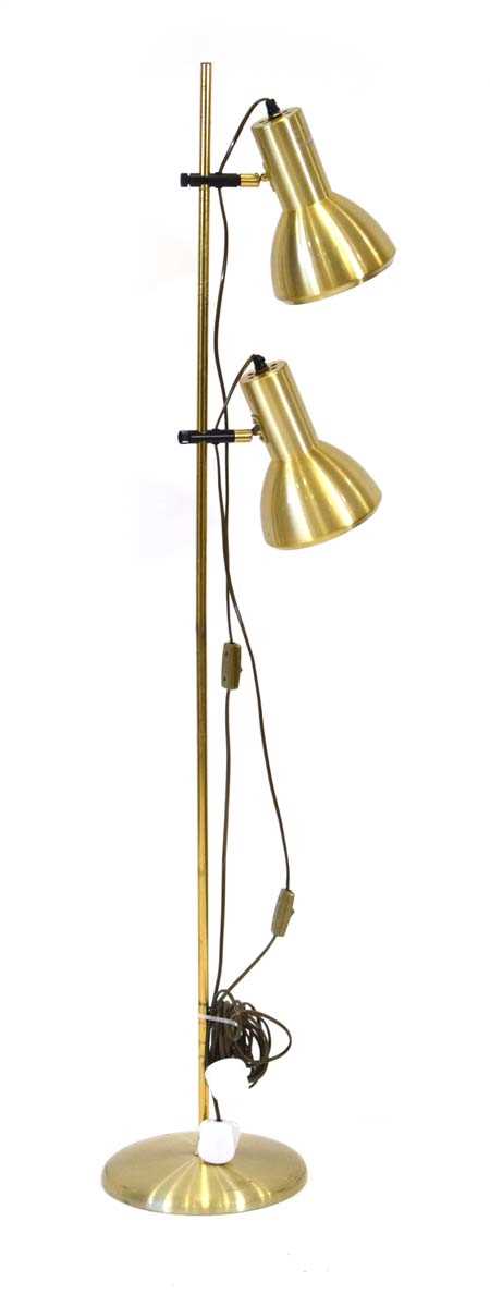 A 1970's Danish brass-finished twin-spot floor lamp Lead cut, working order unknown, some wear.