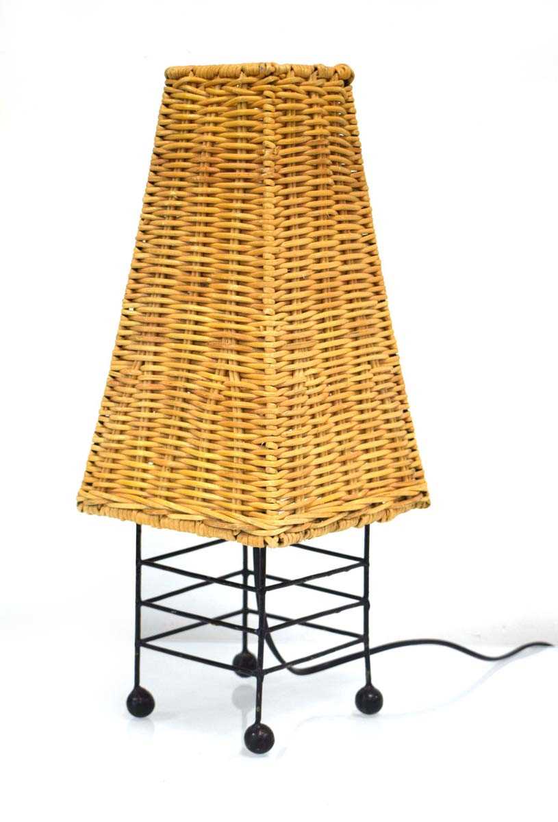 A 1960's tubular metal table lamp with a cane/rattan tapering shade, h. 47 cm