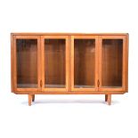 A 1960's 'd-Scan' of Singapore teak sideboard with four glazed doors, on tapering legs, w. 155 cm,