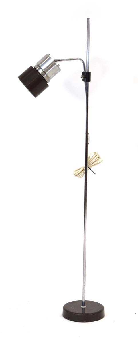 A 1970's Danish aluminium standard lamp with a single partially brown-enamelled shade Lead cut,