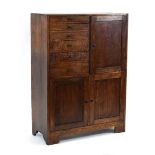 A 1930's oak dentist's cabinet with an arrangement of doors and drawers, 77 x 32 x 106 cm *A similar